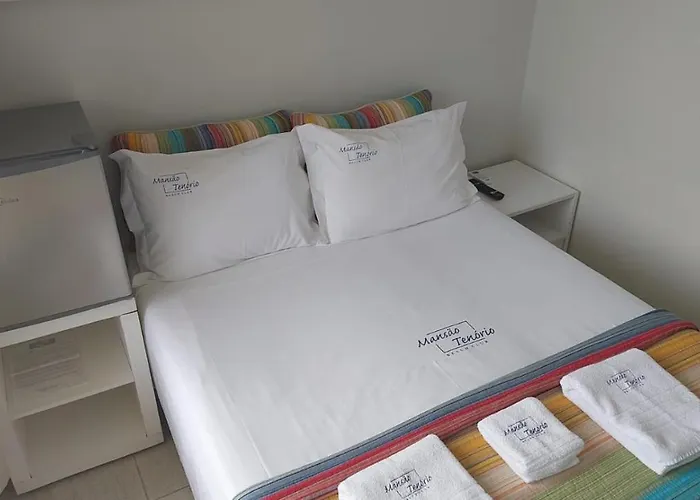 MANSÃO TENÓRIO - Suítes, Estudio ou Cobertura Pé na Areia